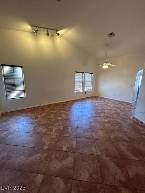7650 Butterscotch Ct, Las Vegas, NV 89131 - unfurnished room featuring track lighting, ceiling fan, and high vaulted ceiling