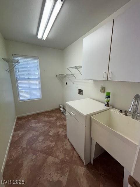 7650 Butterscotch Ct, Las Vegas, NV 89131 - laundry room with cabinet space and baseboards
