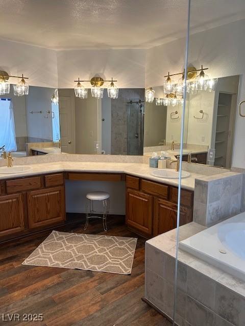 7650 Butterscotch Ct, Las Vegas, NV 89131 - bathroom with wood finished floors, a garden tub, and double vanity