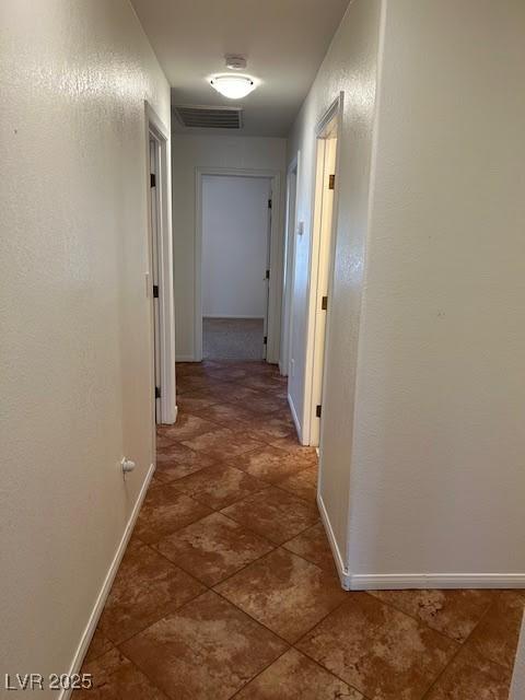 7650 Butterscotch Ct, Las Vegas, NV 89131 - hallway featuring baseboards
