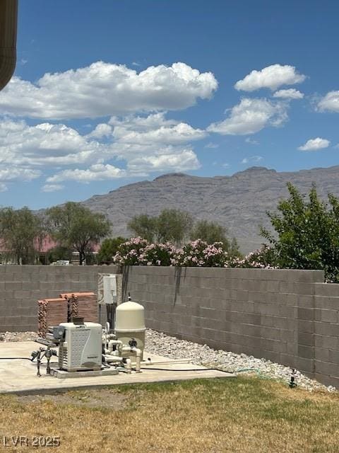 7650 Butterscotch Ct, Las Vegas, NV 89131 - view of yard featuring a mountain view and a patio area