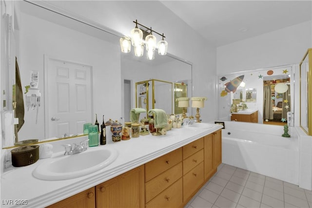 bathroom featuring double vanity, a bath, a shower stall, a sink, and tile patterned floors
