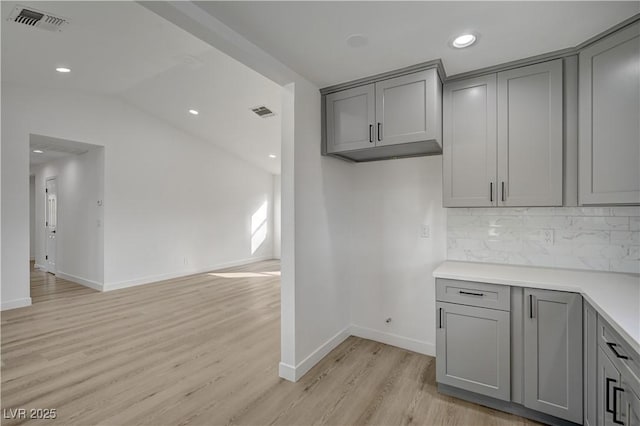 4419 Fairmont Cir, Las Vegas, NV 89147 - kitchen with baseboards, gray cabinetry, visible vents, and light wood-type flooring