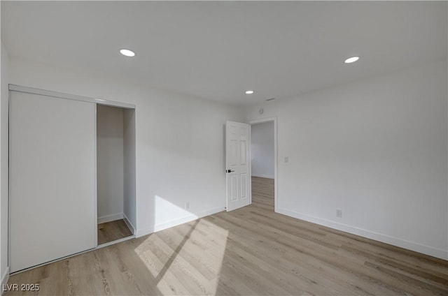 4419 Fairmont Cir, Las Vegas, NV 89147 - unfurnished bedroom featuring recessed lighting, baseboards, a closet, and light wood-style floors