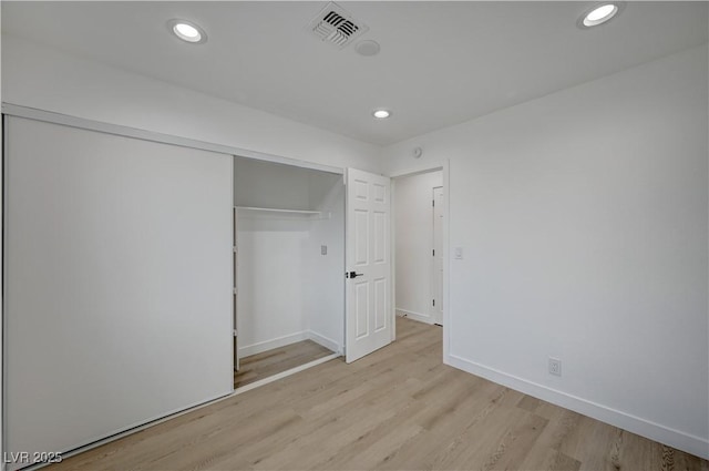 4419 Fairmont Cir, Las Vegas, NV 89147 - unfurnished bedroom featuring recessed lighting, visible vents, light wood finished floors, and a closet