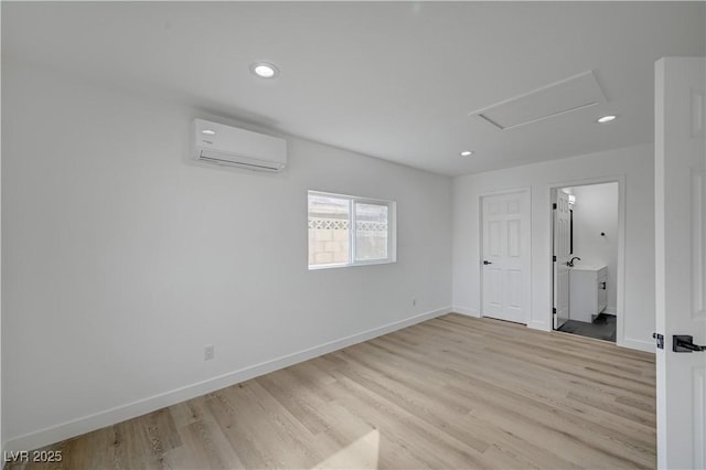 4419 Fairmont Cir, Las Vegas, NV 89147 - empty room with recessed lighting, baseboards, a wall mounted AC, and light wood-type flooring