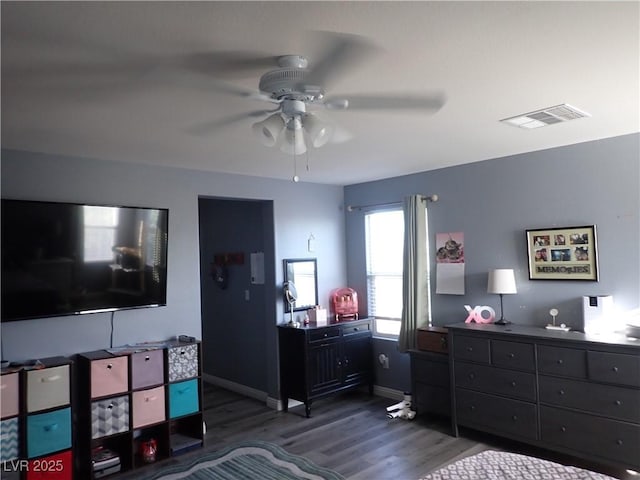 4361 Duck Harbor Ave, North Las Vegas, NV 89031 - bedroom with a ceiling fan, baseboards, visible vents, and wood finished floors