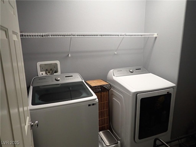 4361 Duck Harbor Ave, North Las Vegas, NV 89031 - laundry room with separate washer and dryer and laundry area