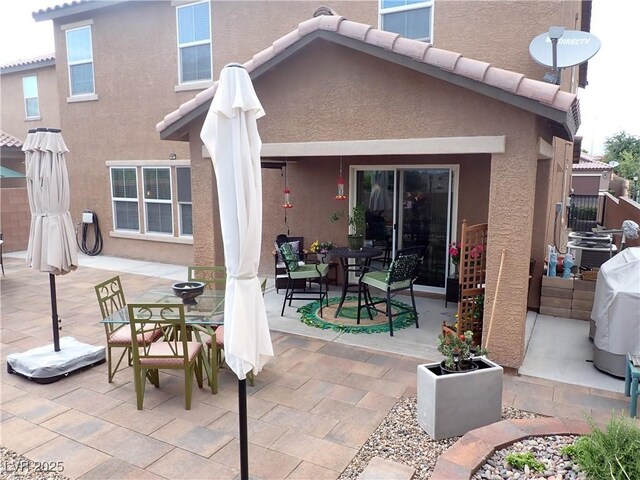 4361 Duck Harbor Ave, North Las Vegas, NV 89031 - rear view of property with outdoor dining space, stucco siding, and a patio area