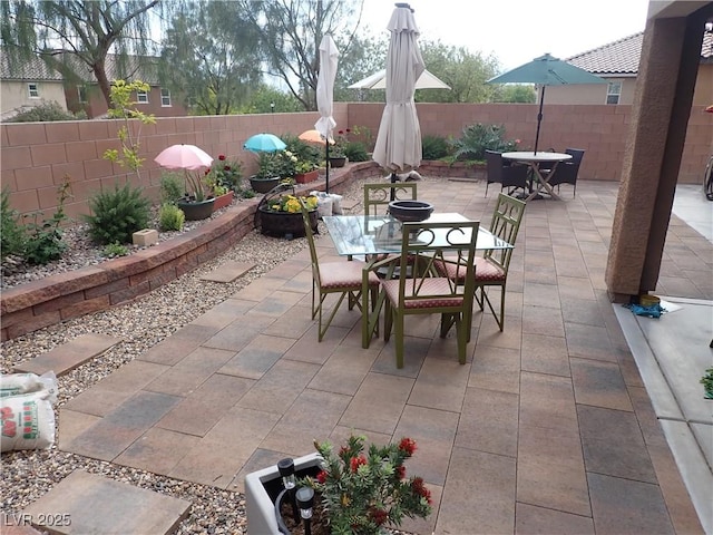 4361 Duck Harbor Ave, North Las Vegas, NV 89031 - view of patio with outdoor dining space and a fenced backyard