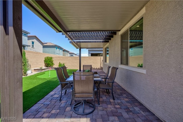 view of patio featuring a fenced backyard and outdoor dining space