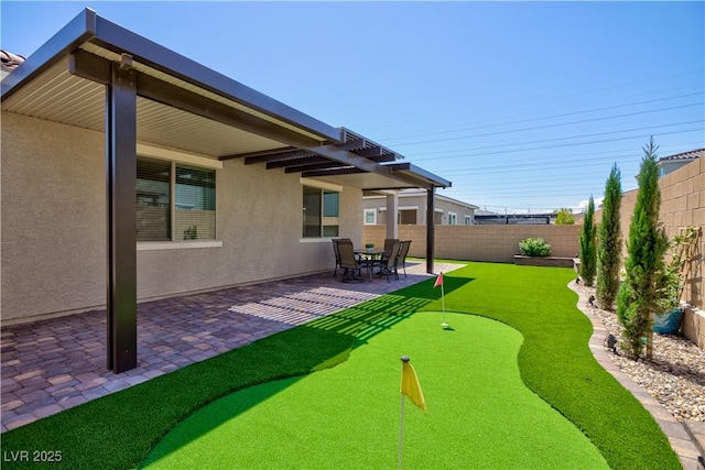 view of yard with a patio and a fenced backyard