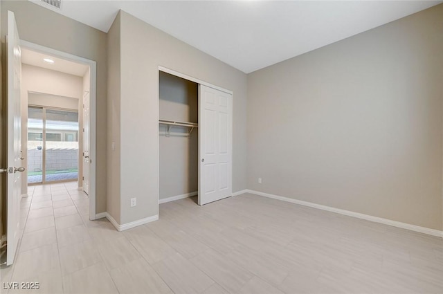 10251 Tiger Milkweed St, Las Vegas, NV 89141 - unfurnished bedroom featuring baseboards and a closet