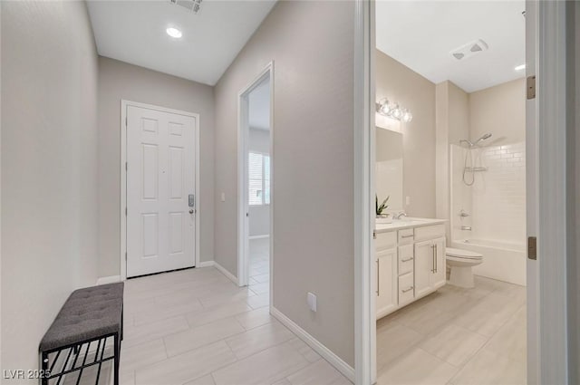 10251 Tiger Milkweed St, Las Vegas, NV 89141 - hall featuring light tile patterned floors and a sink