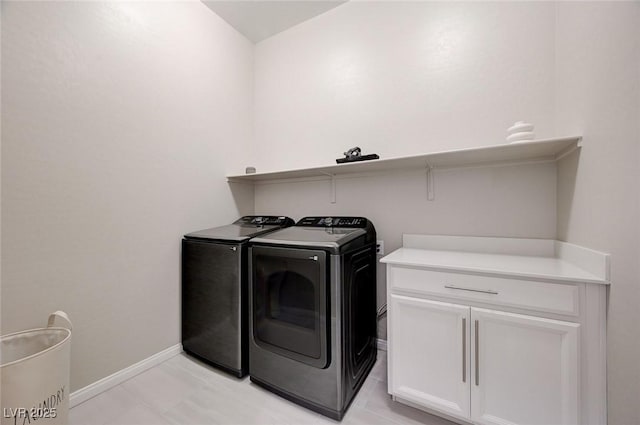 10251 Tiger Milkweed St, Las Vegas, NV 89141 - laundry area with washing machine and clothes dryer and cabinet space