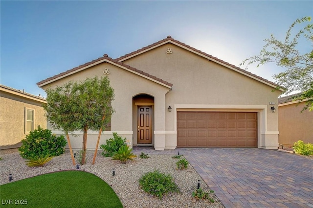 10251 Tiger Milkweed St, Las Vegas, NV 89141 - mediterranean / spanish-style house with stucco siding, a garage, driveway, and a tile roof