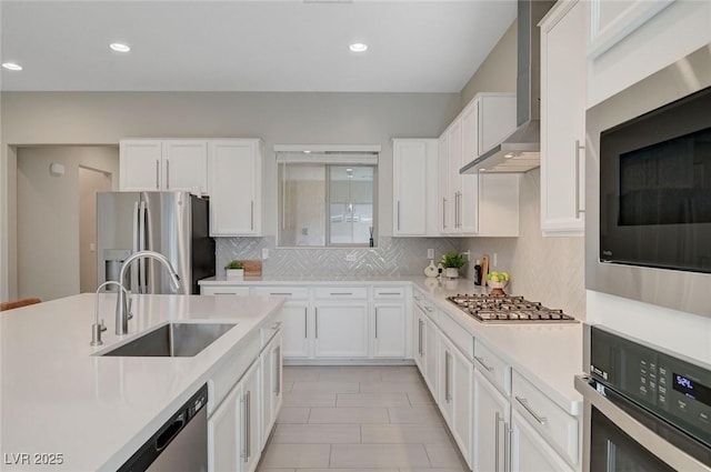10251 Tiger Milkweed St, Las Vegas, NV 89141 - kitchen featuring wall chimney exhaust hood, stainless steel appliances, light countertops, white cabinets, and recessed lighting