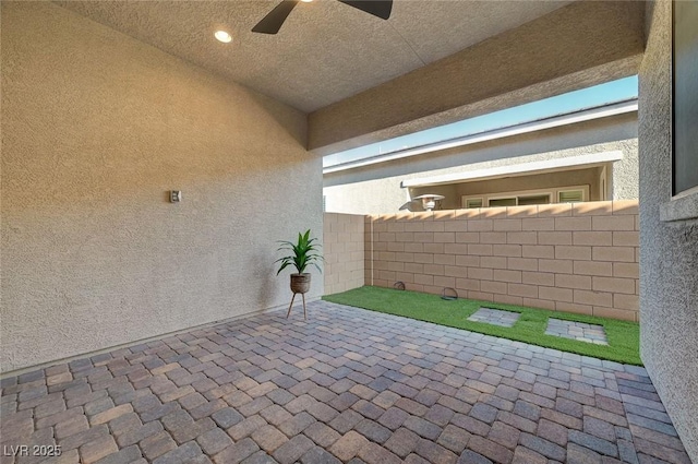 10251 Tiger Milkweed St, Las Vegas, NV 89141 - fenced backyard with a patio and ceiling fan
