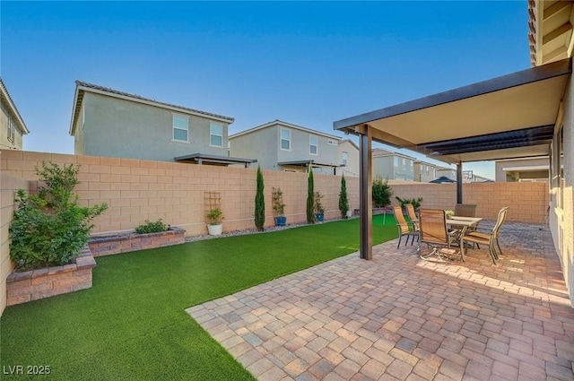 10251 Tiger Milkweed St, Las Vegas, NV 89141 - fenced backyard featuring a patio and outdoor dining area