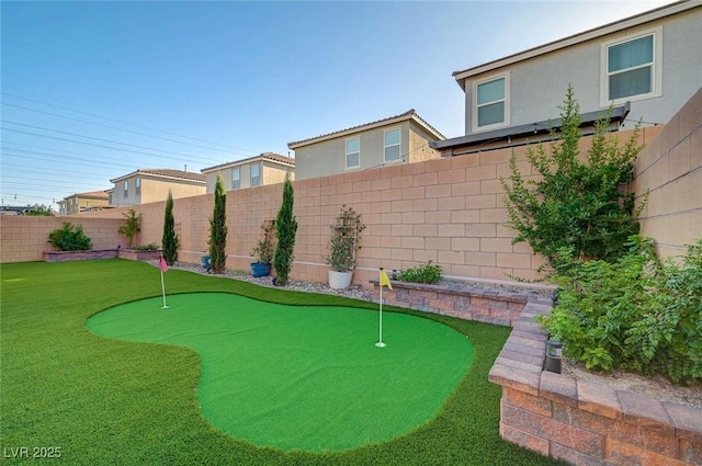 10251 Tiger Milkweed St, Las Vegas, NV 89141 - fenced backyard with an area to practice putting