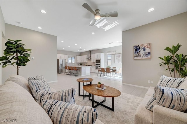 10251 Tiger Milkweed St, Las Vegas, NV 89141 - living area featuring a ceiling fan, recessed lighting, a chandelier, and light wood finished floors
