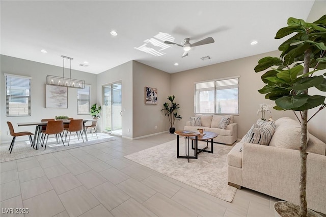 10251 Tiger Milkweed St, Las Vegas, NV 89141 - living area with a ceiling fan, a chandelier, and recessed lighting