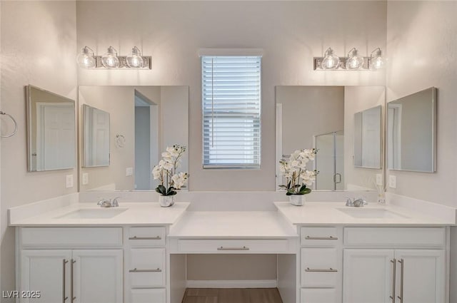 10251 Tiger Milkweed St, Las Vegas, NV 89141 - full bathroom featuring double vanity, plenty of natural light, and a shower with door