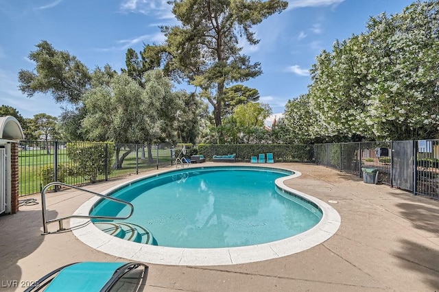 view of pool featuring fence and a patio area