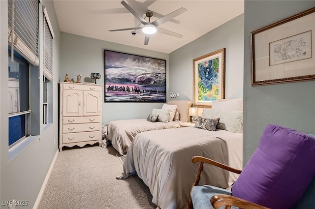 bedroom with baseboards, carpet, and ceiling fan