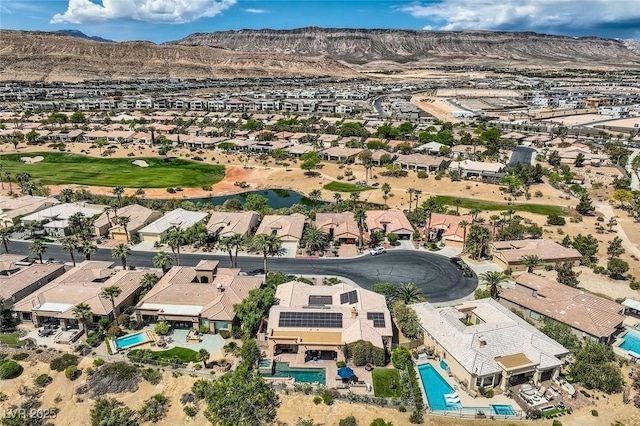 birds eye view of property with a residential view and a mountain view