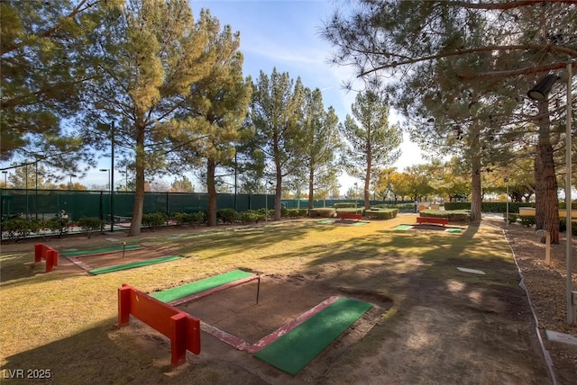 view of home's community with fence