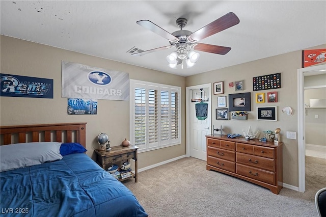 bedroom with carpet floors, baseboards, visible vents, and ceiling fan