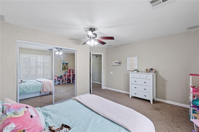 carpeted bedroom with visible vents, a ceiling fan, baseboards, and a closet