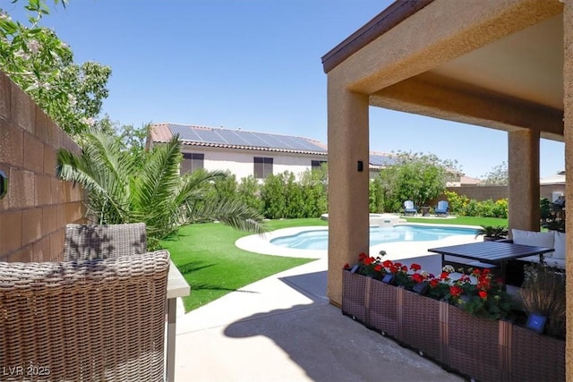 exterior space featuring a fenced in pool and a fenced backyard
