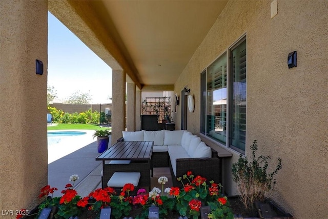 view of patio with a fenced in pool, fence, and outdoor lounge area