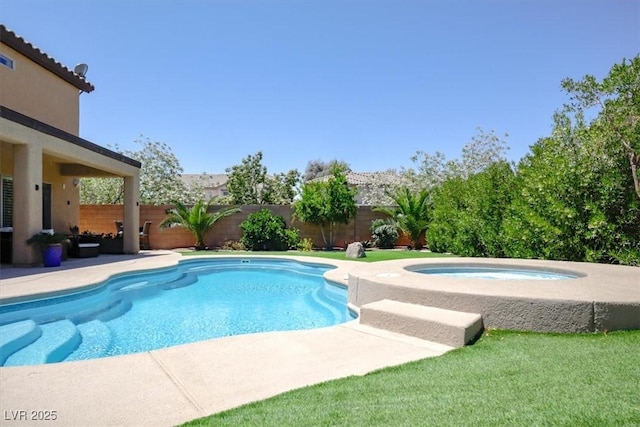view of swimming pool featuring an in ground hot tub, a lawn, a patio area, a fenced in pool, and a fenced backyard