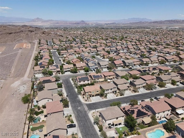 birds eye view of property featuring a mountain view and a residential view