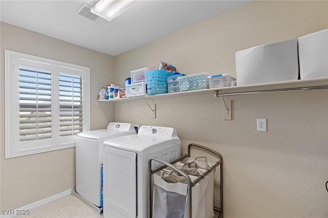 laundry room with laundry area, baseboards, washer and dryer, and visible vents