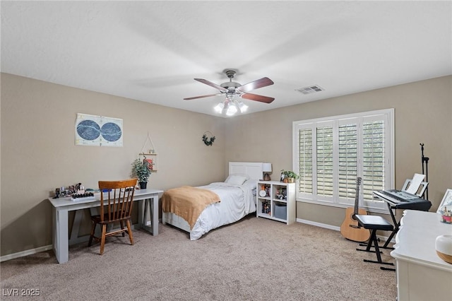 carpeted bedroom with baseboards, ceiling fan, and visible vents