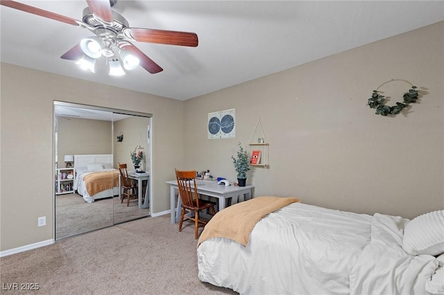 carpeted bedroom featuring baseboards, ceiling fan, and a closet