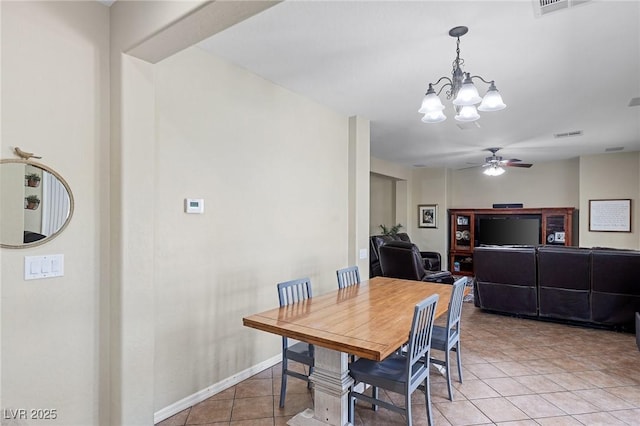 dining area with visible vents, baseboards, ceiling fan with notable chandelier, and light tile patterned floors