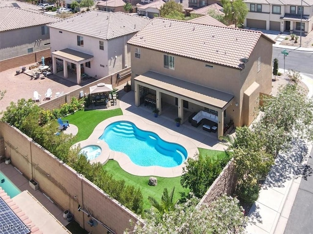 view of pool featuring a patio, a gazebo, a residential view, and a fenced backyard