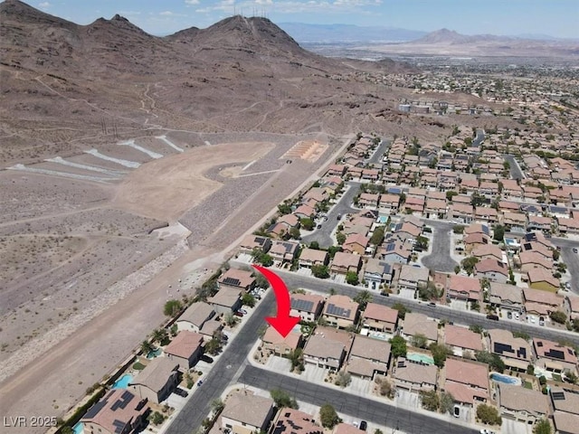 birds eye view of property featuring a residential view and a mountain view