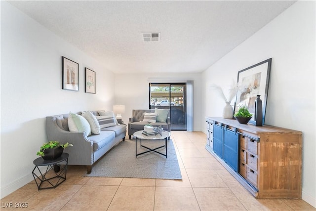 3151 Soaring Gulls Dr Unit 1168, Las Vegas, NV 89128 - living room featuring baseboards, visible vents, and light tile patterned floors