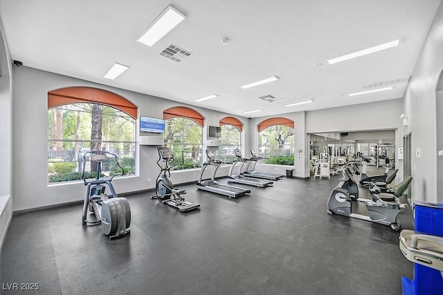 exercise room featuring baseboards and visible vents
