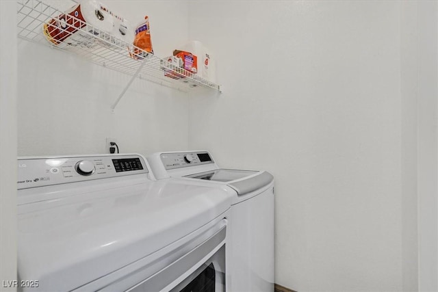 washroom with laundry area and washer and clothes dryer