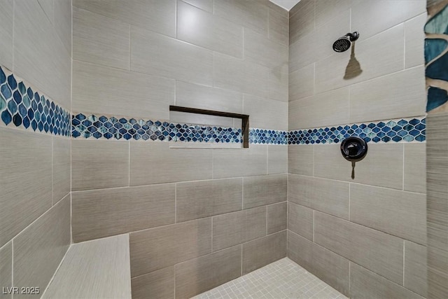 bathroom featuring tiled shower