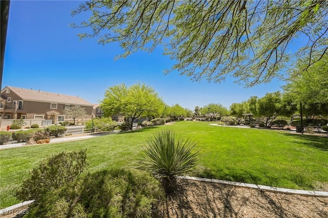 view of property's community with a yard