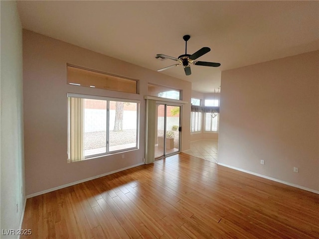 2925 Big Green Ln, Las Vegas, NV 89134 - unfurnished room featuring a ceiling fan, baseboards, and light wood-style flooring