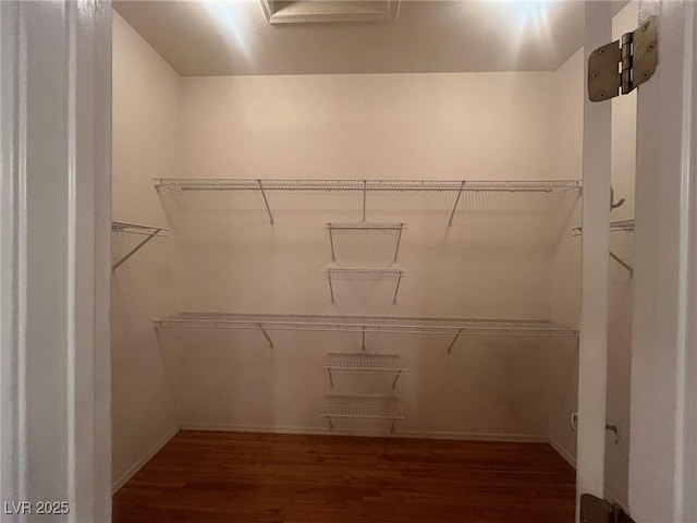 2925 Big Green Ln, Las Vegas, NV 89134 - spacious closet featuring wood finished floors